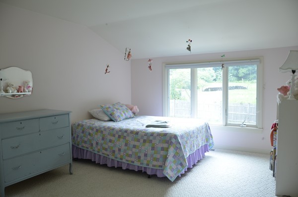 3 West Whitehall Road Amesbury, MA 01913 - Photo 16 of 18 a bedroom with a bed and a window
