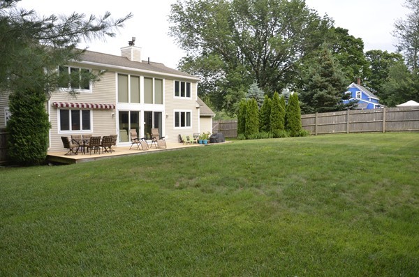 3 West Whitehall Road Amesbury, MA 01913 - Photo 3 of 18 a front view of a house with a yard and trees