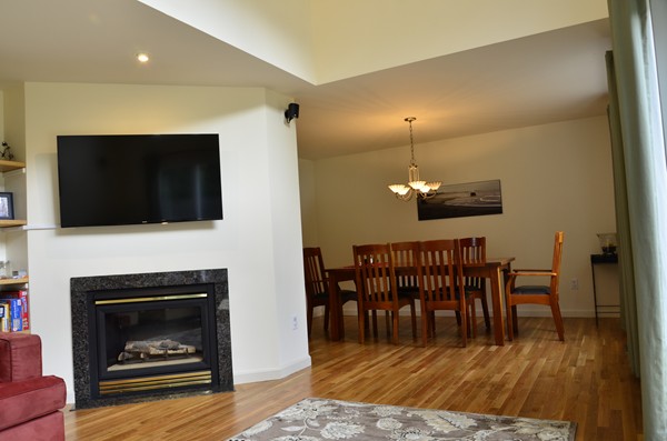 3 West Whitehall Road Amesbury, MA 01913 - Photo 7 of 18 a living room with furniture a flat screen tv and a fireplace