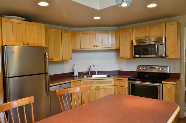 3 West Whitehall Road Amesbury, MA 01913 - Photo 8 of 18 a kitchen with a sink a stove and refrigerator