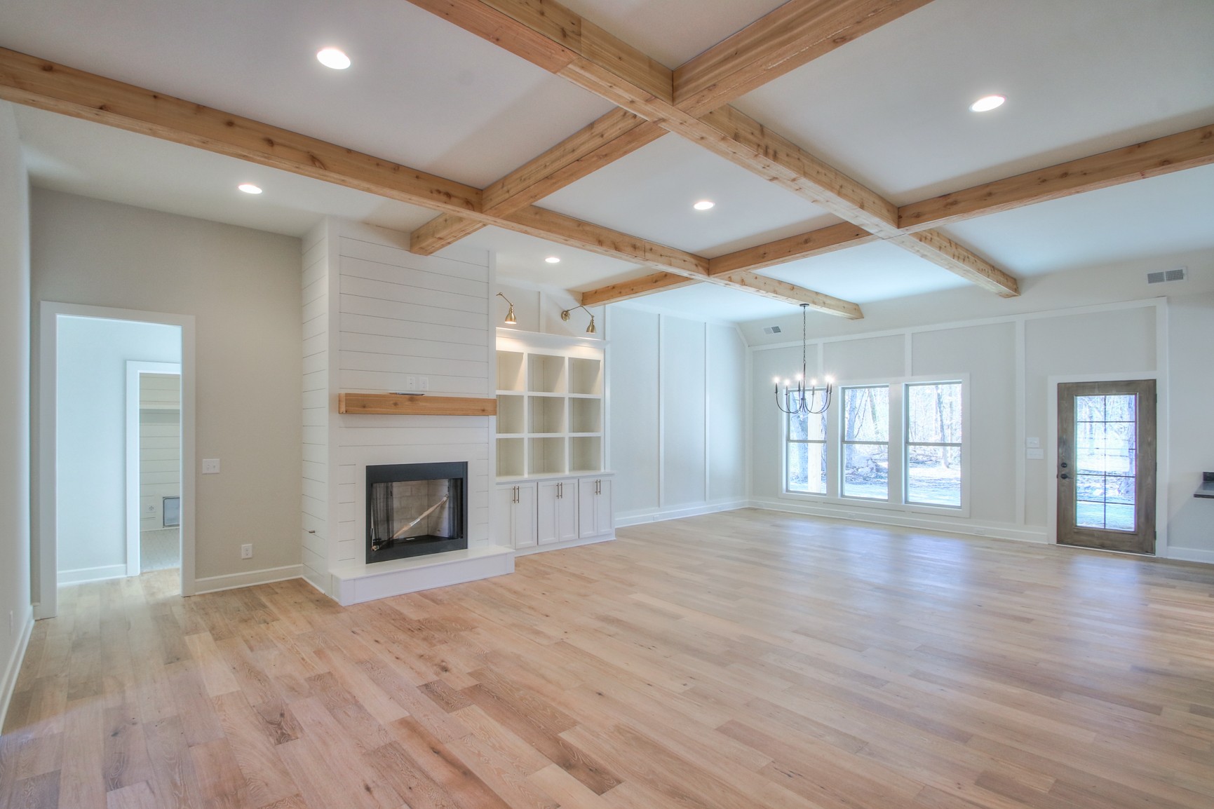 6680 Murfreesboro Road Lebanon, TN 37090 - Photo 7 of 31 a view of an empty room with wooden floor fireplace and a window