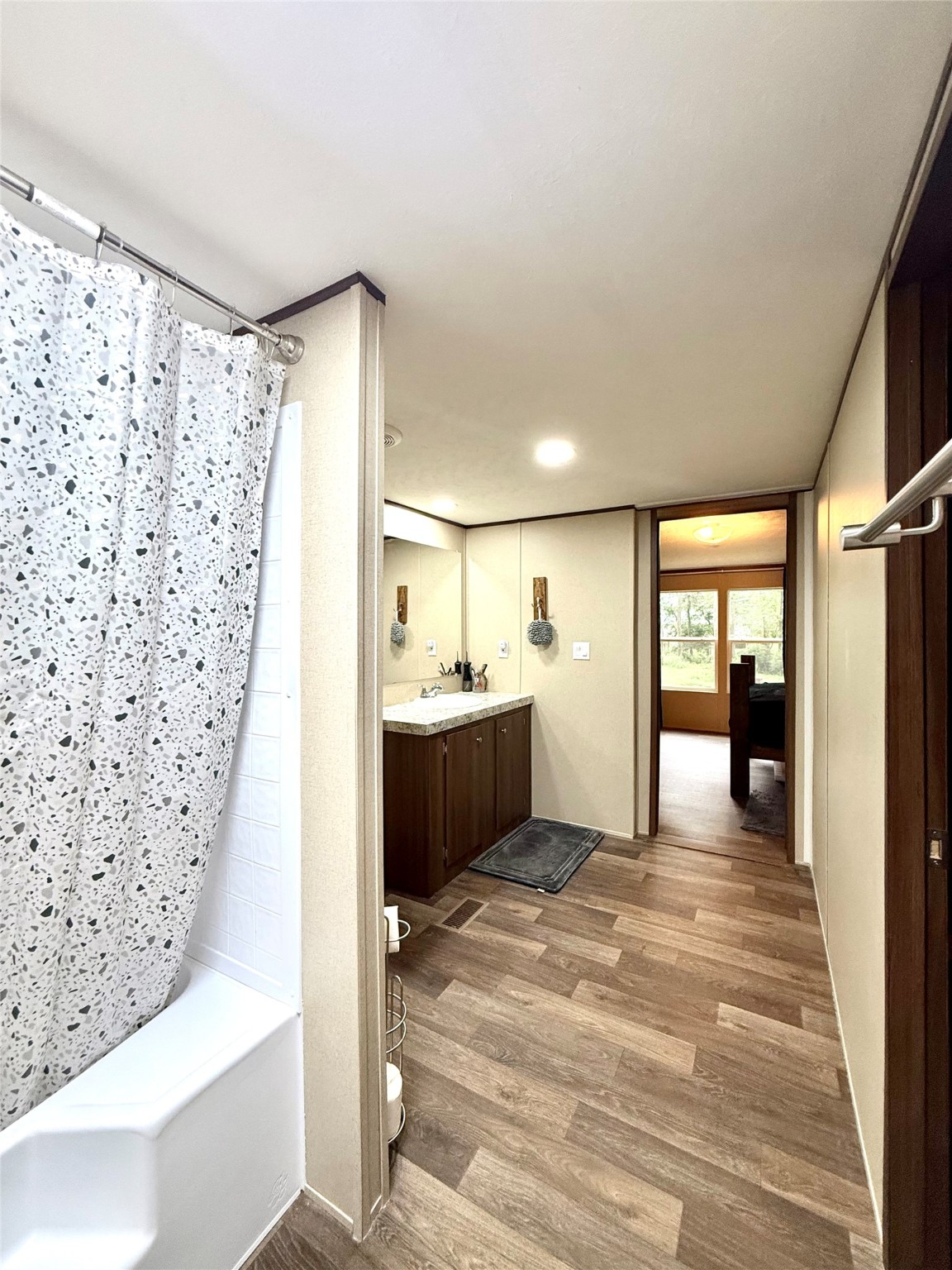 17008 FM 1484 Road Conroe, TX 77303 - Photo 15 of 36 a view of a bathroom with a bathtub and a shower