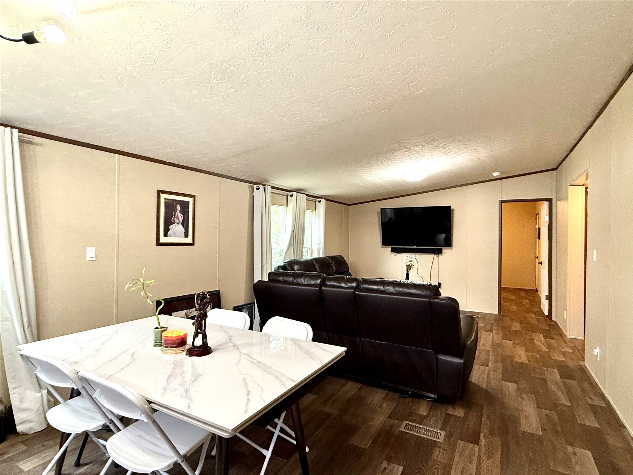 17008 FM 1484 Road Conroe, TX 77303 - Photo 20 of 36 a living room with furniture and a flat screen tv