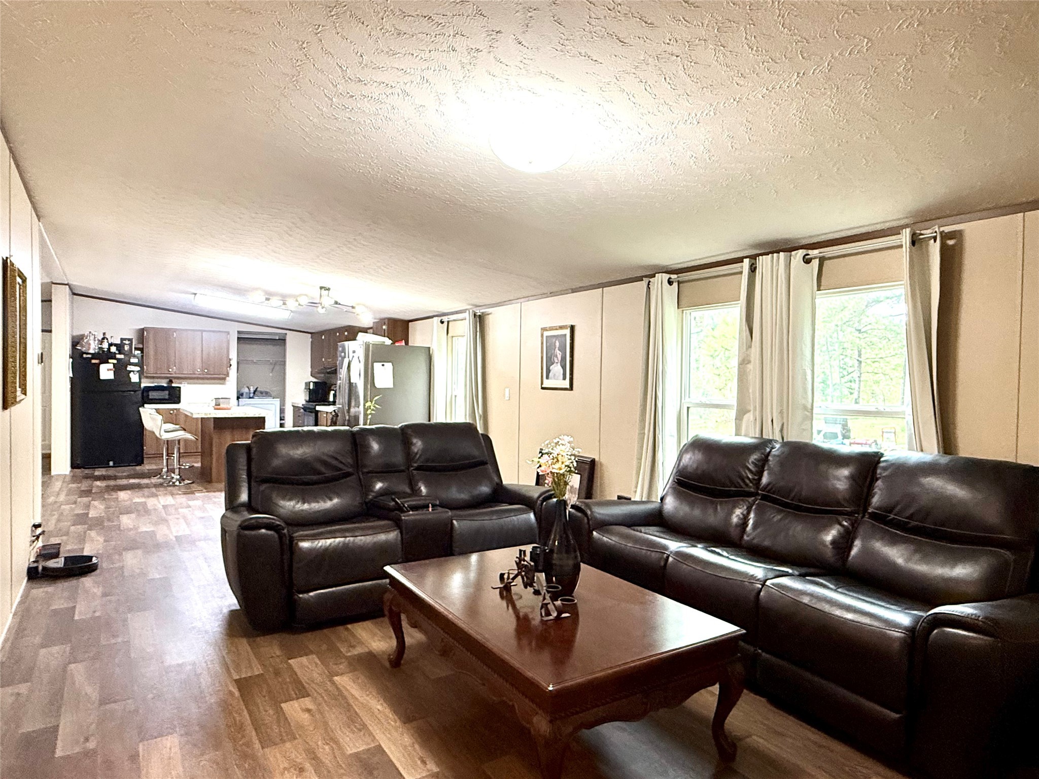 17008 FM 1484 Road Conroe, TX 77303 - Photo 22 of 36 a living room with furniture and a large window