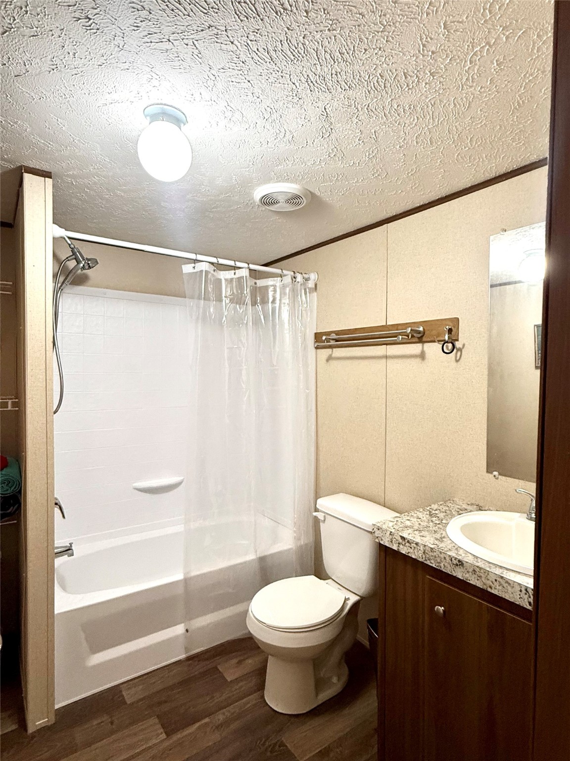 17008 FM 1484 Road Conroe, TX 77303 - Photo 27 of 36 a bathroom with a granite countertop sink toilet and shower