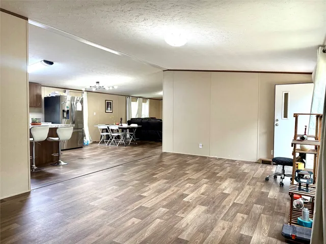 a view of a room with furniture and a window