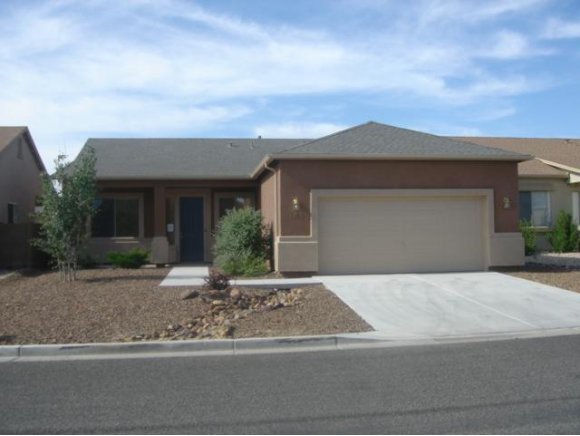 4785 Edgemont Road Prescott Valley, AZ 86314 - Photo 1 of 9 a front view of a house with yard