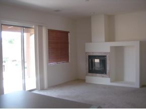 4785 Edgemont Road Prescott Valley, AZ 86314 - Photo 3 of 9 a view of an empty room with window and fire place