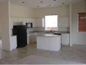 4785 Edgemont Road Prescott Valley, AZ 86314 - Photo 9 of 9 a kitchen with a sink and cabinets