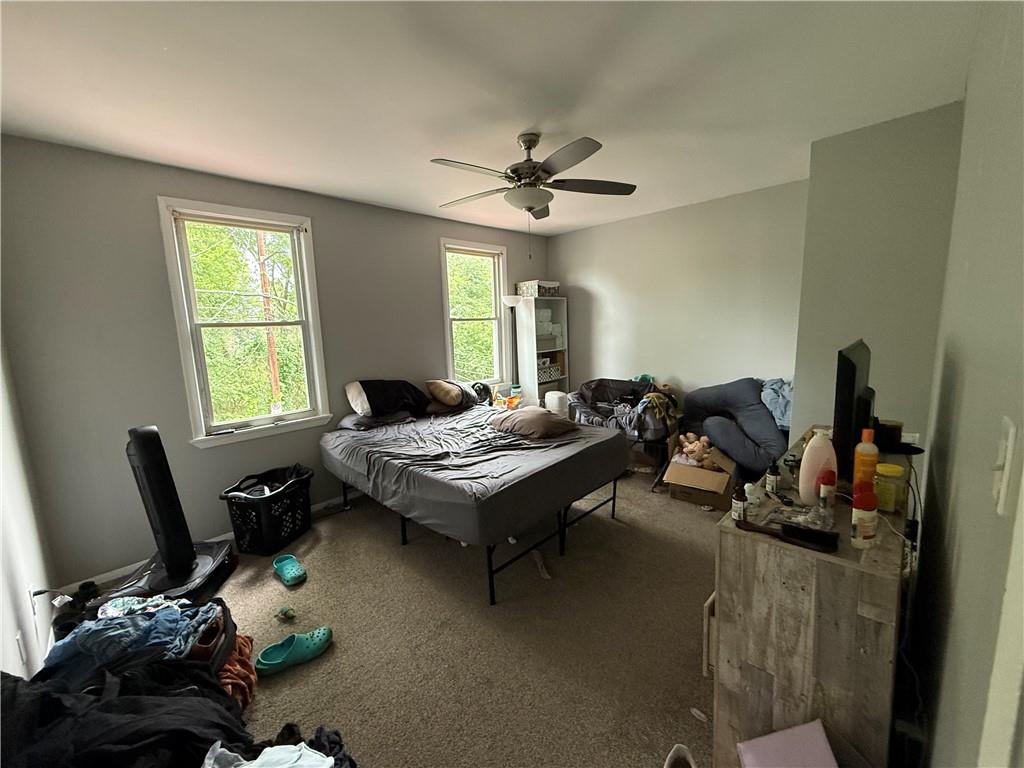 1336 Complete Street Pittsburgh, PA 15212 - Photo 8 of 14 a living room with furniture a bed and a window