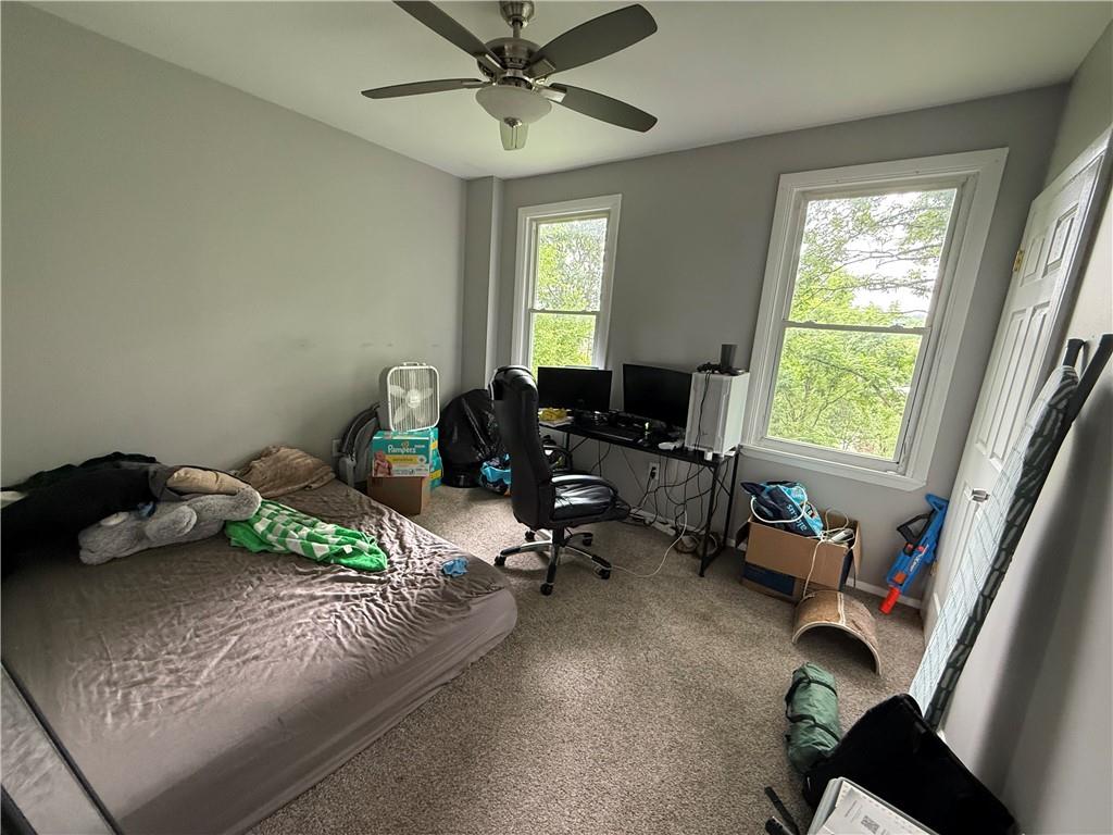 1336 Complete Street Pittsburgh, PA 15212 - Photo 9 of 14 a bedroom with a bed and a window