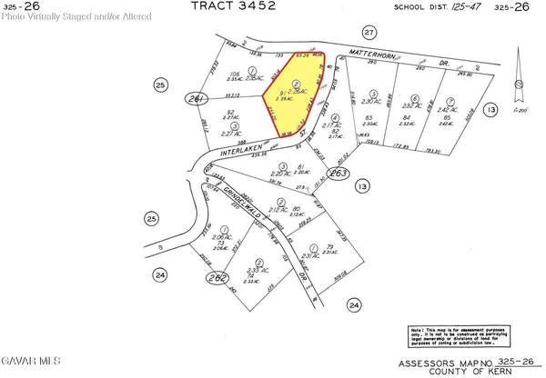 a view of a couch in a white wall