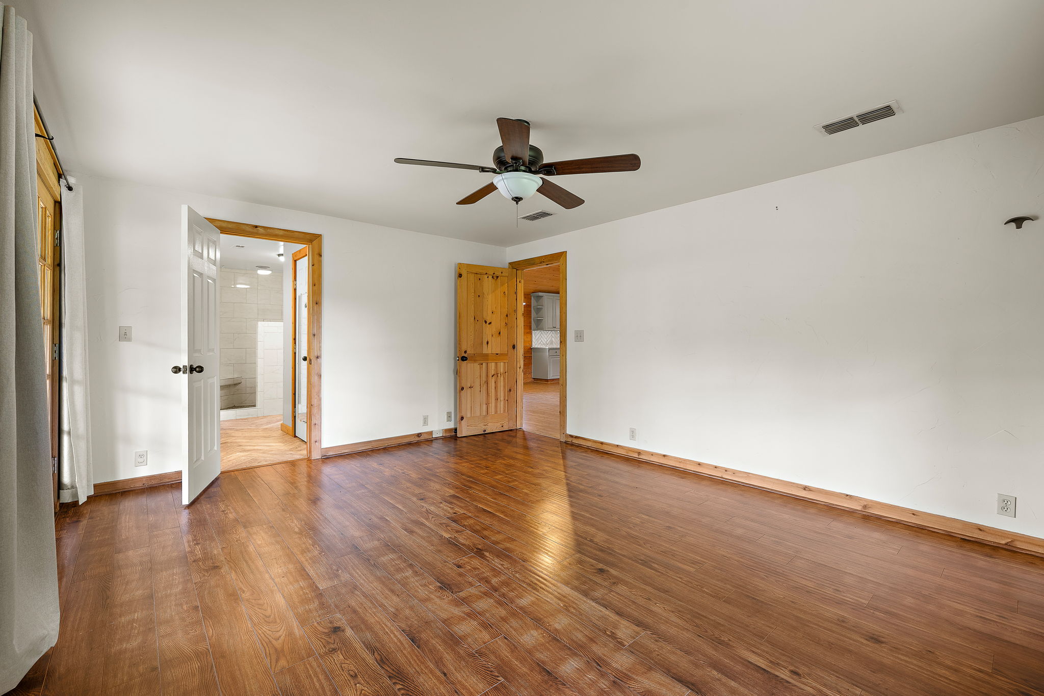 571 Balch Road Elgin, TX 78621 - Photo 15 of 33 Spacious interior with wood-finish flooring and white walls