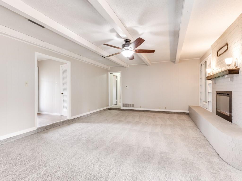7335 Reed Road Azle, TX 76020 - Photo 11 of 36 a view of an empty room with a fireplace