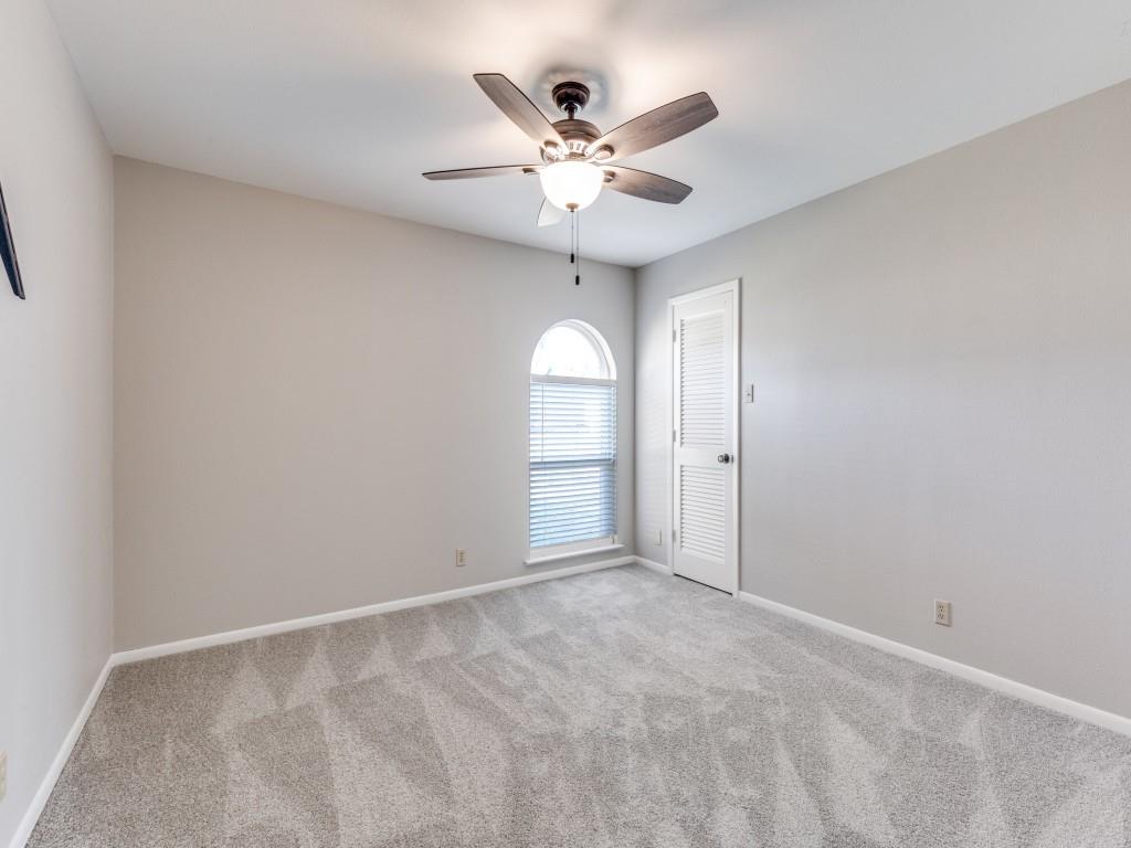 7335 Reed Road Azle, TX 76020 - Photo 24 of 36 an empty room with fan and windows