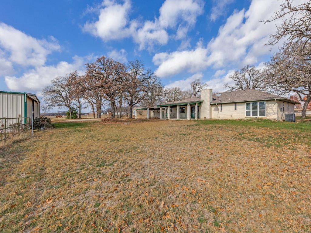 7335 Reed Road Azle, TX 76020 - Photo 3 of 36 a view of a house with a yard
