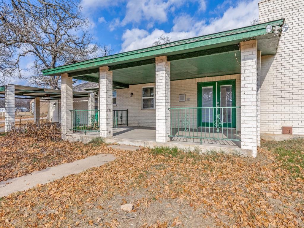 7335 Reed Road Azle, TX 76020 - Photo 5 of 36 front view of a house with a porch
