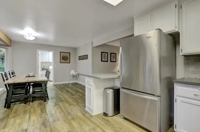 a bedroom with a bed and a lamp on table