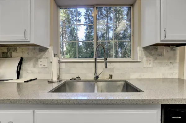 a bedroom with a bed and a television