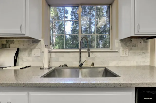 a bedroom with a bed and a television