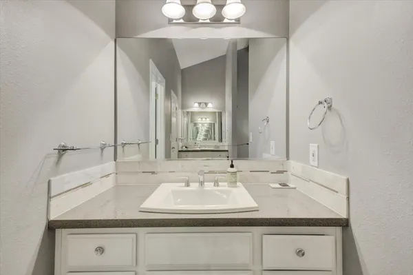 a view of a deck with table and chairs and wooden floor