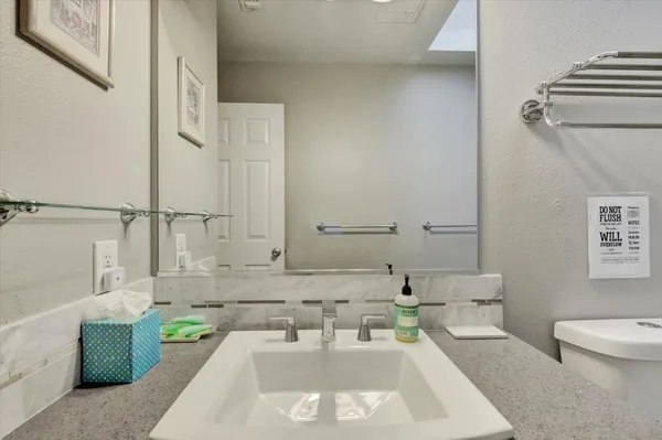 a view of a house with a yard and roof