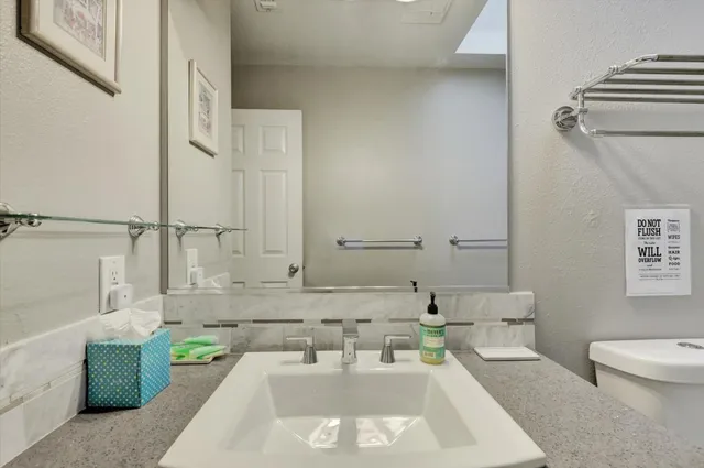 a view of a house with a yard and roof