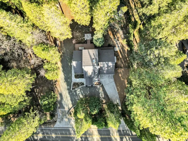a view of a dinning table and chairs in patio of the house