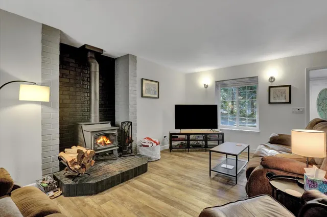 a kitchen with a sink a counter top space stainless steel appliances and cabinets