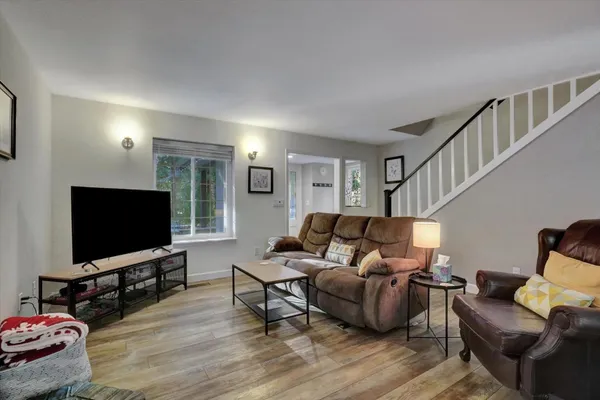 a kitchen with a refrigerator stove and microwave