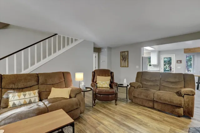 a kitchen with cabinets stainless steel appliances a sink and a window