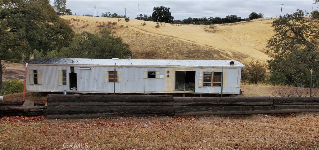 7126 Coyote Point Corning, CA 96021 - Photo 18 of 18 a view of a house with a yard