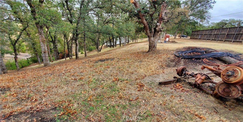 7126 Coyote Point Corning, CA 96021 - Photo 3 of 18 a view of backyard with wooden fence