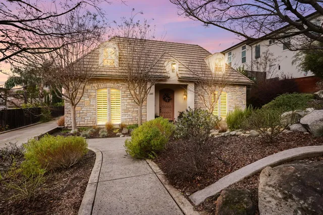 a front view of a house with garden