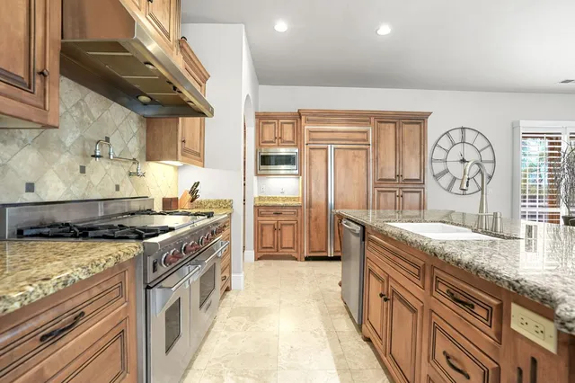 a bathroom with a bathtub sink and a mirror
