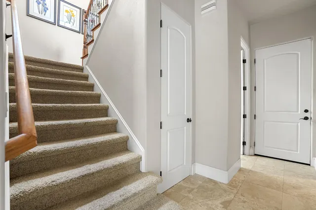 a view of a house with pool table and chairs