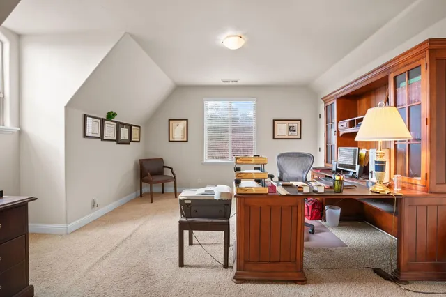 an aerial view of multiple houses with yard