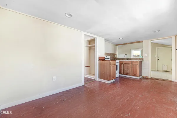 a view of a kitchen with a sink and cabinet