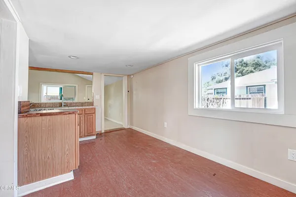 a view of kitchen with wooden floor