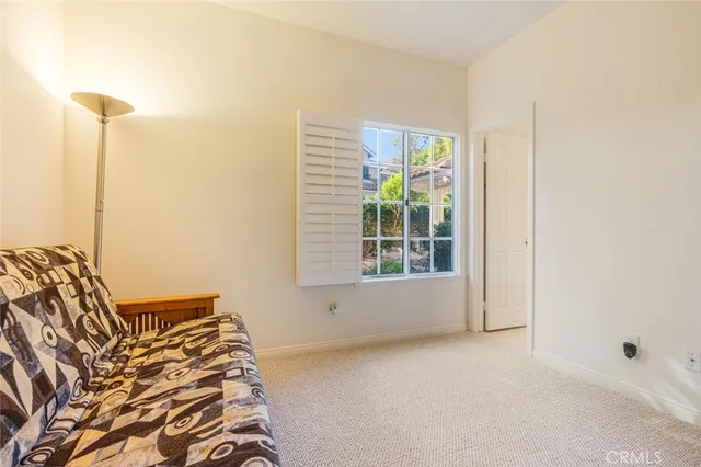 a view of a bedroom with window