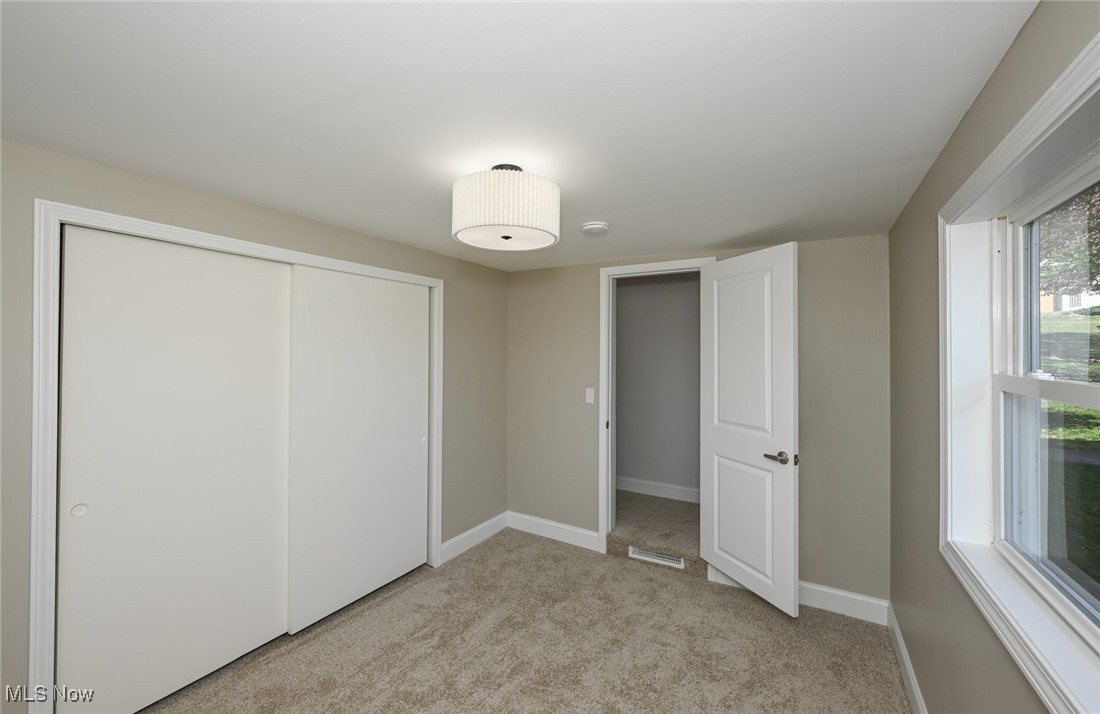 14328 Calaboone Road Doylestown, OH 44230 - Photo 22 of 45 Unfurnished bedroom with light carpet and a closet