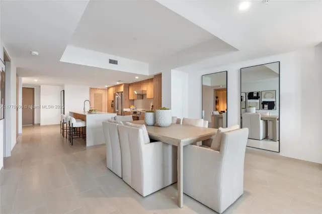a living room with a balcony furniture and a large window