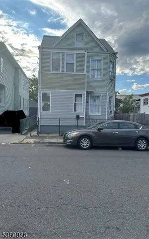 a car parked in front of a house
