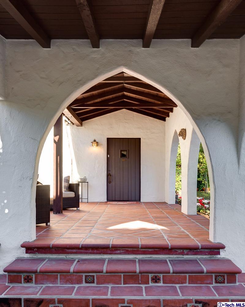 3301 Mount Curve Avenue Altadena, CA 91001 - Photo 2 of 29 a bedroom with a bed and a large window
