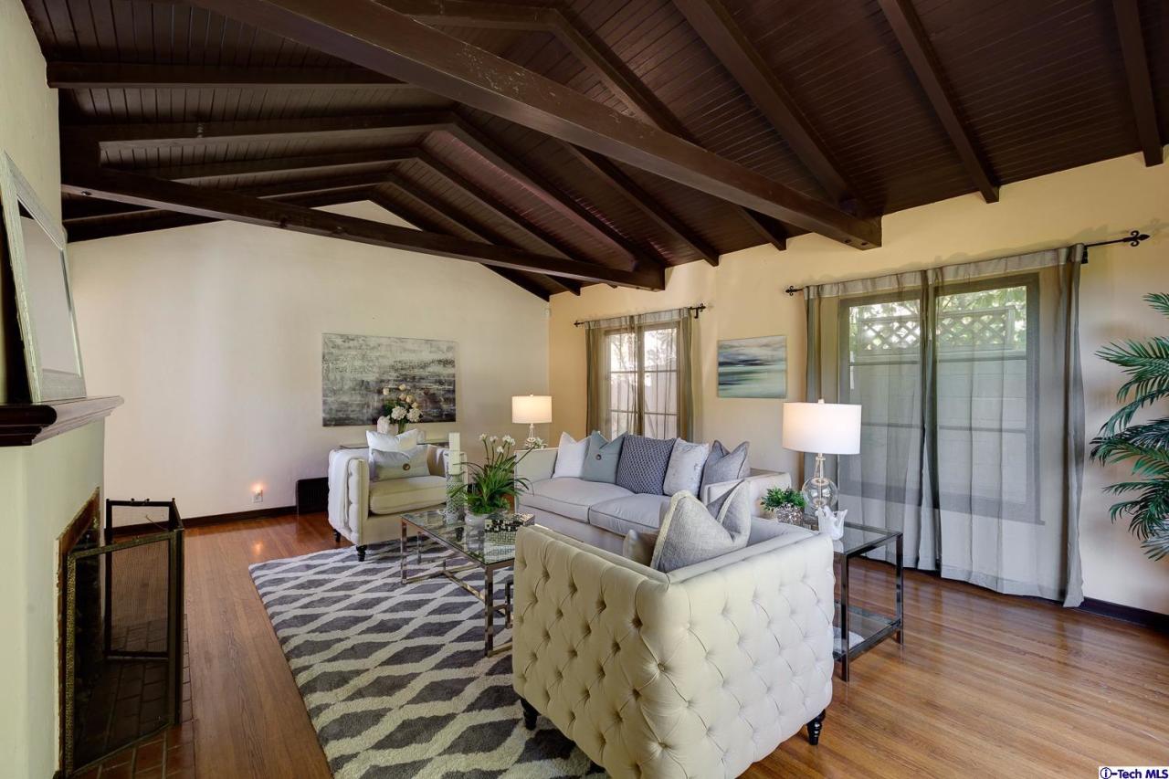 3301 Mount Curve Avenue Altadena, CA 91001 - Photo 11 of 29 a living room with furniture and a wooden floor