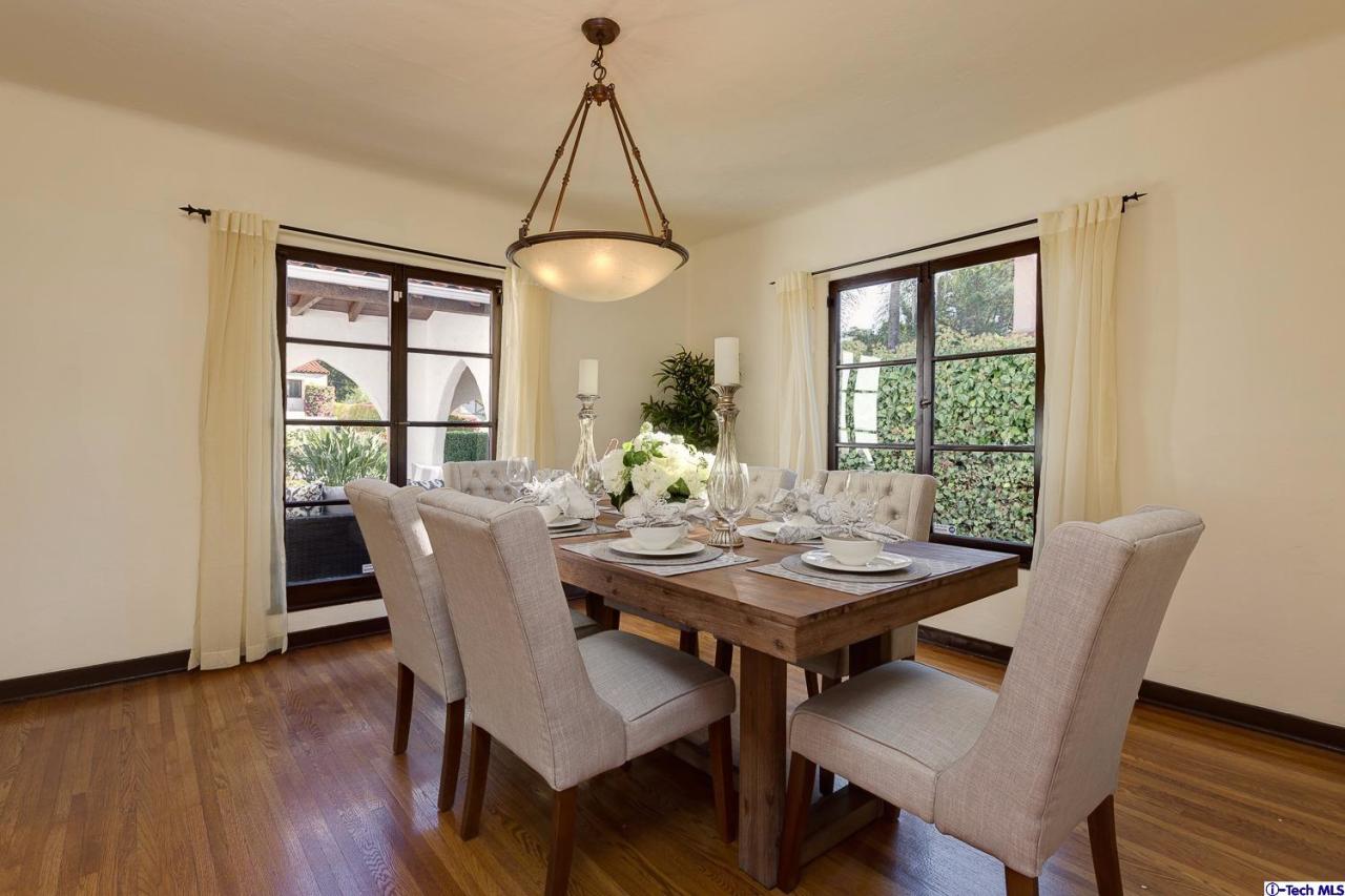 3301 Mount Curve Avenue Altadena, CA 91001 - Photo 13 of 29 a view of a dining room with furniture window and wooden floor