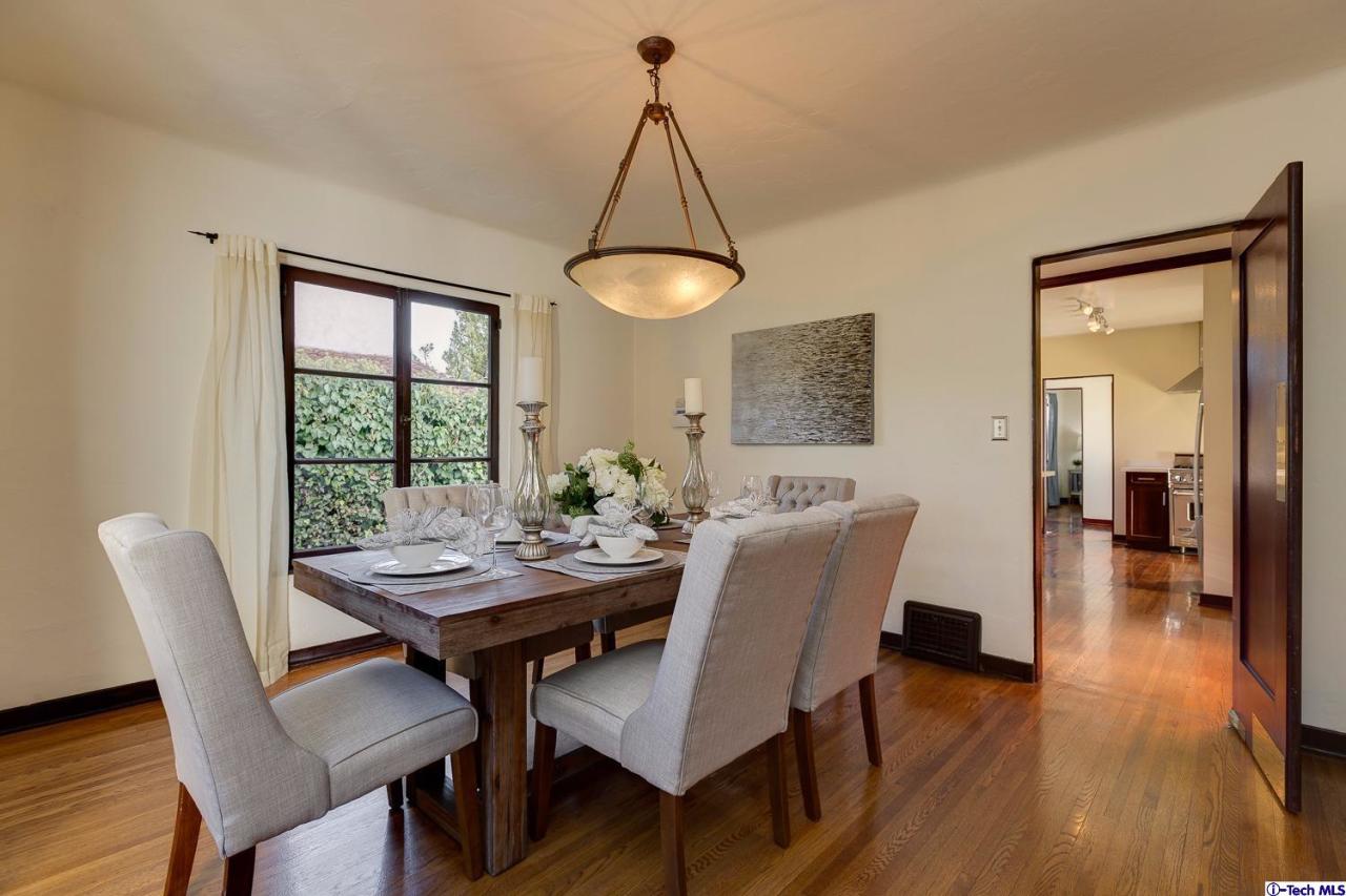 3301 Mount Curve Avenue Altadena, CA 91001 - Photo 14 of 29 a view of a dining room with furniture window and wooden floor