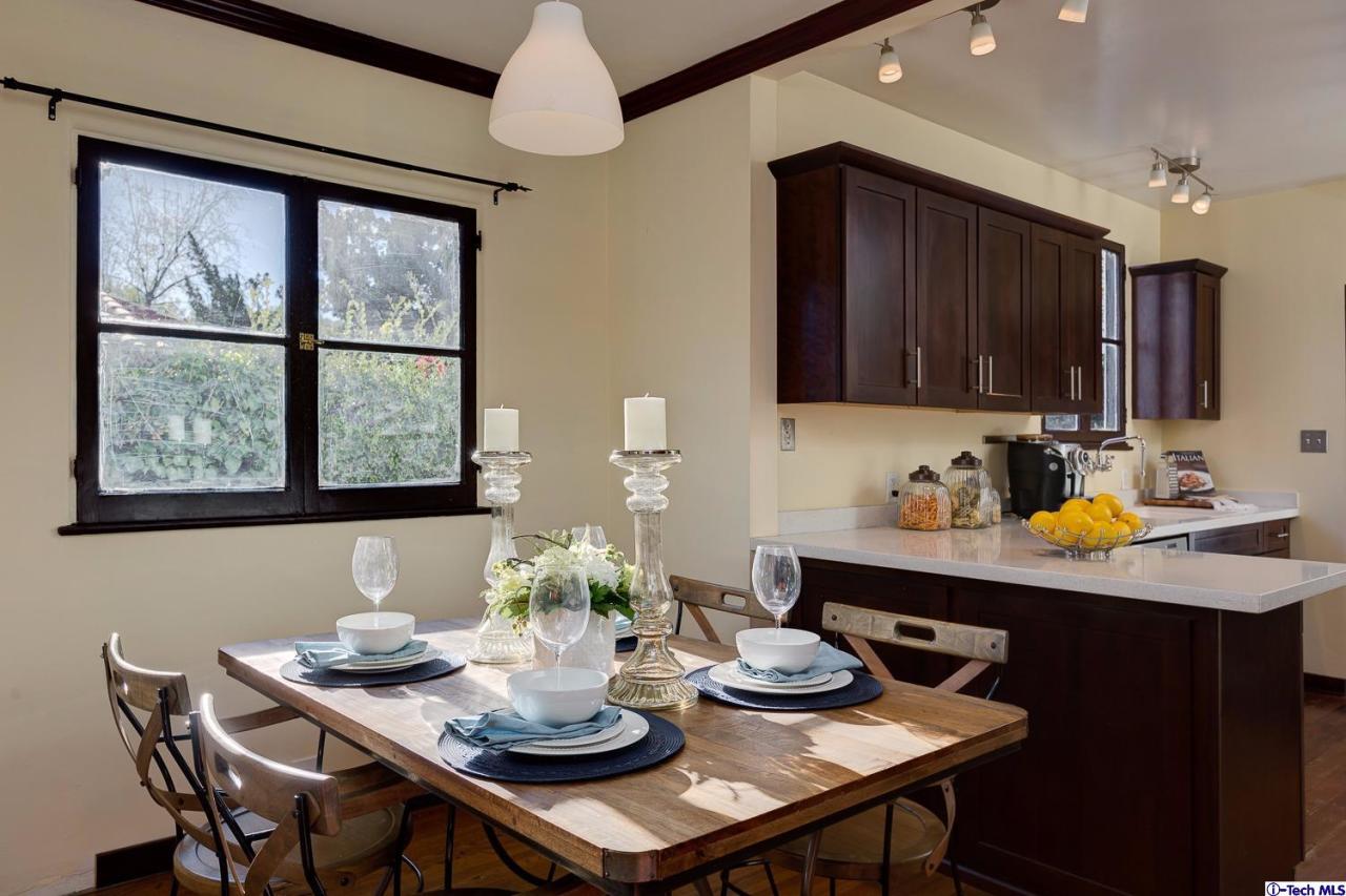 3301 Mount Curve Avenue Altadena, CA 91001 - Photo 17 of 29 a dining room with furniture and window