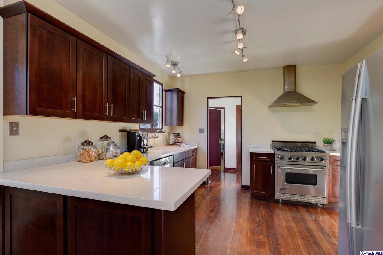 3301 Mount Curve Avenue Altadena, CA 91001 - Photo 18 of 29 a kitchen with a sink appliances and cabinets