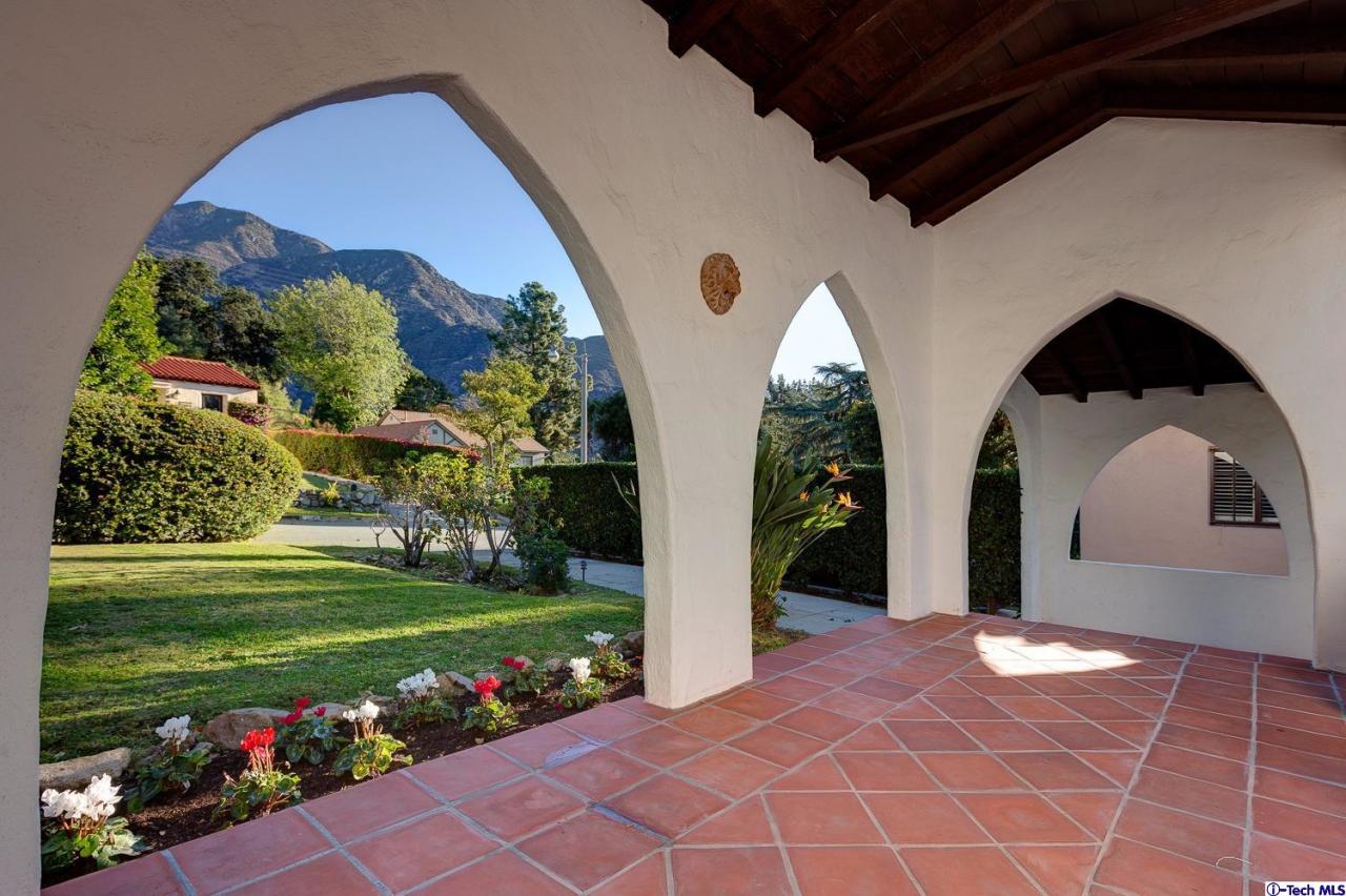 3301 Mount Curve Avenue Altadena, CA 91001 - Photo 3 of 29 a front view of a house with a yard